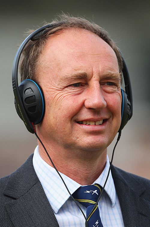 A portrait of Jonathan Agnew wearing headphones