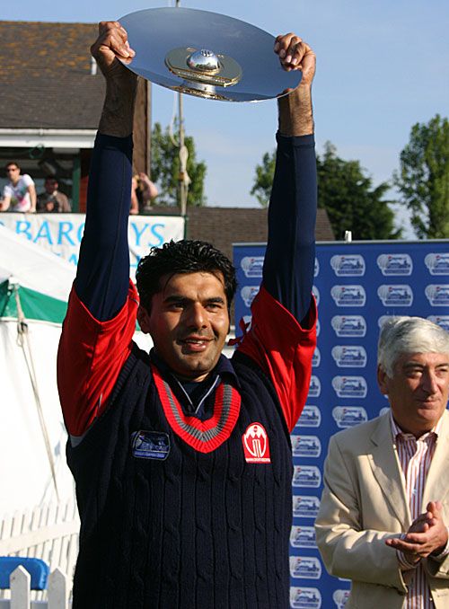 Bahrain captain Yaser Sadeq poses with the winner's trophy