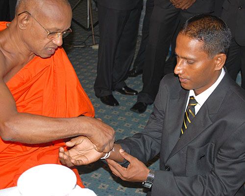 Indika de Saram gets the blessings of a monk