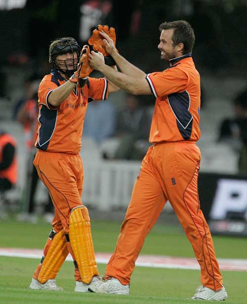 Jeroen Smits and Bas Zuiderent celebrate a wicket