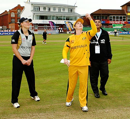 Aimee Watkins looks on as Karen Rolton flips the coin