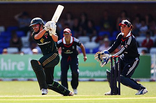 Lauren Ebsary crashes through the off side, watched by Sarah Taylor