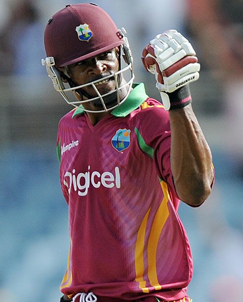 Runako Morton punches the air after steering West Indies home