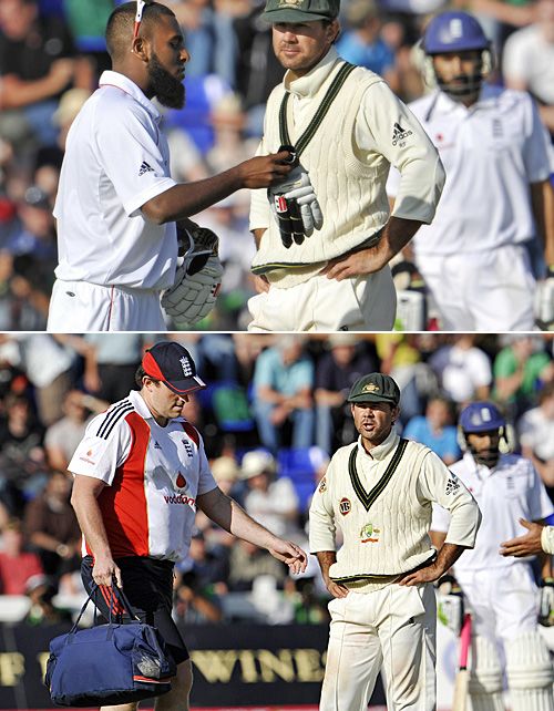 Ricky Ponting is not amused as England's 12th man, Bilal Shafayat and their physio interrupt play during the final moments of the first Test