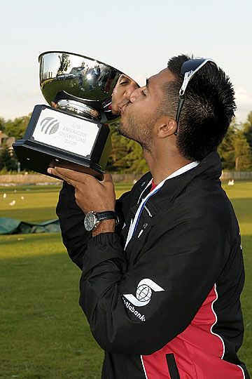 Arsalan Qadir of Canada kisses the trophy