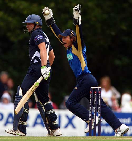 Tom Burrows goes up for a catch to remove Luke Wright