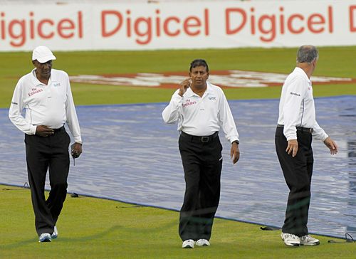 The umpires do a recce of the playing conditions