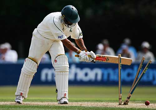 Scott Newman swipes at his stumps after being bowled