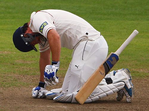 Mal Loye hits the deck after being hit by a Graham Onions delivery