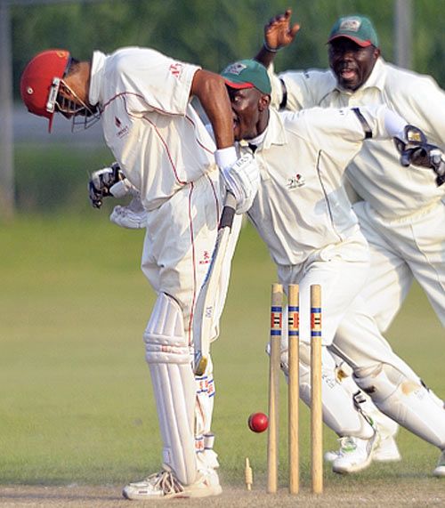 Sandeep Jyoti is clean bowled by Hiren Varaiya just before the close