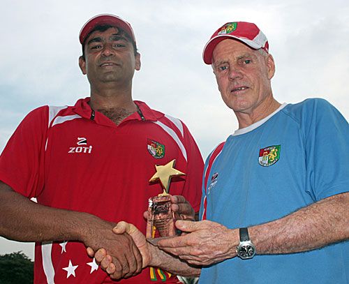 Man of the Match Saad Janjua is congratulated by Singapore coach Trevor Chappell
