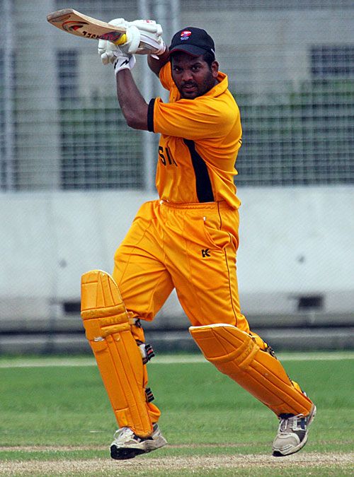 Malaysia's Rakesh Madhavan plays a stylish punch through the off side