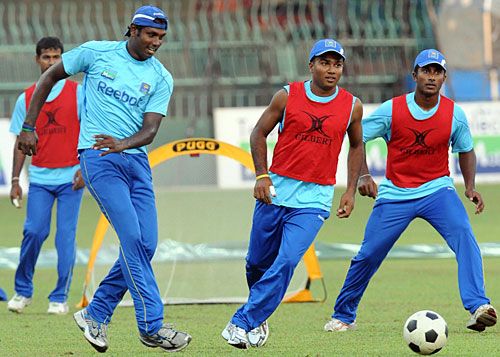Angelo Mathews, Gihan Rupasinghe and Mahela Udawatte play football
