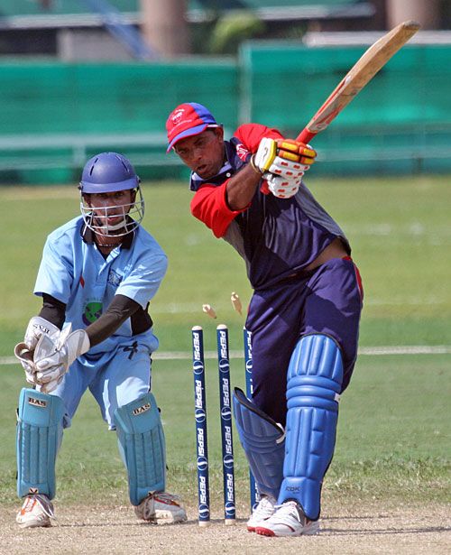 Bahrain's Adil Hanif is bowled for 24