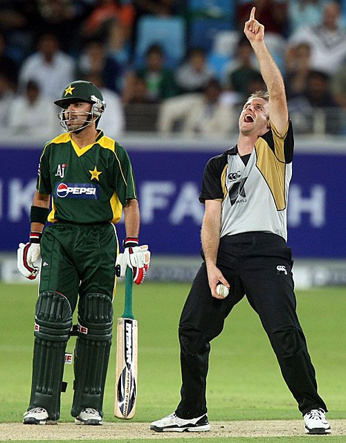 Aaron Redmond is delighted after taking a return catch