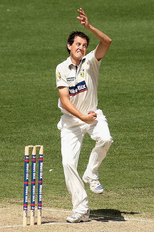 Bryce McGain bowls during his four-wicket haul