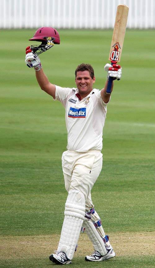 Nick Kruger celebrates his century