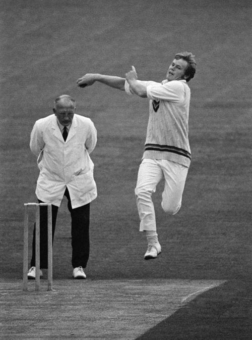 Mike Procter bowls
