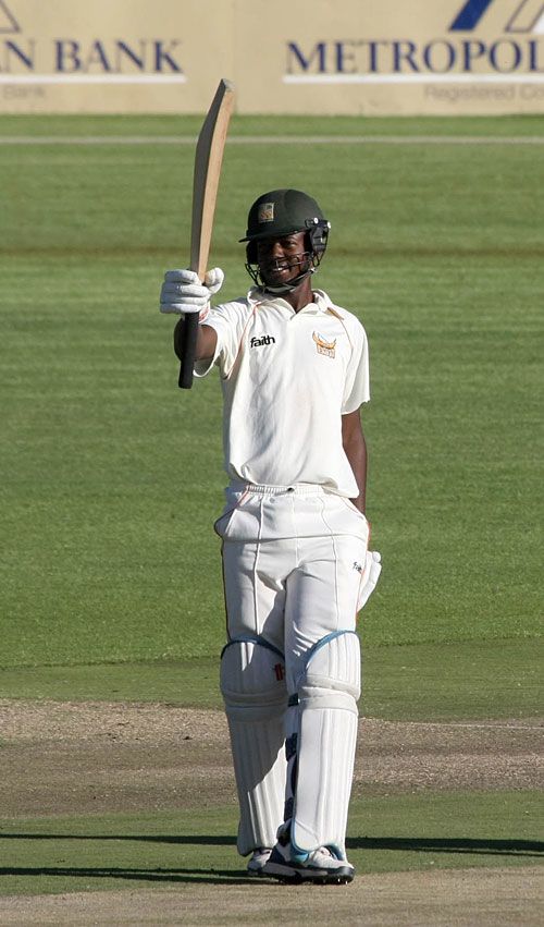 Foster Mutizwa celebrates reaching his hundred for the Mashonaland Eagles against the Mid West Rhinos