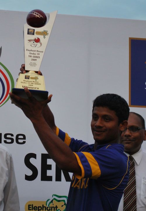 Sri Lankan Under-19 captain Chathura Peiris holds the title aloft