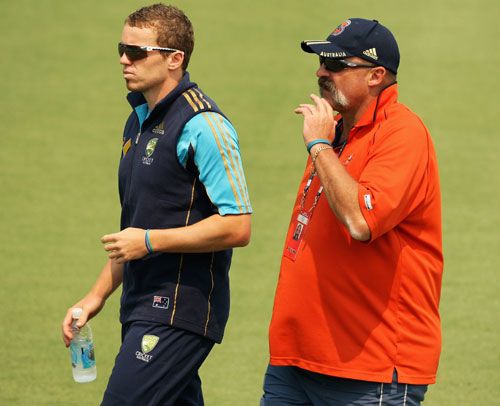 Peter Siddle talks to the selector Merv Hughes before pulling out of the third Test