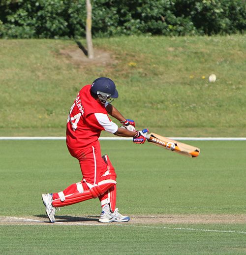 Ashish Gadhia lofts the ball down the ground against Canada U19