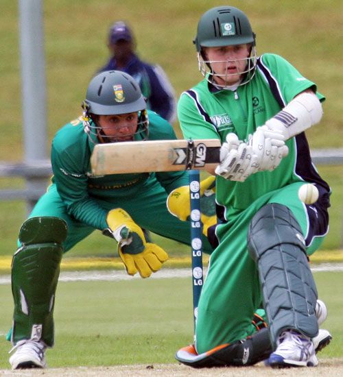 Ireland's Ben Ackland sweeps during his 66