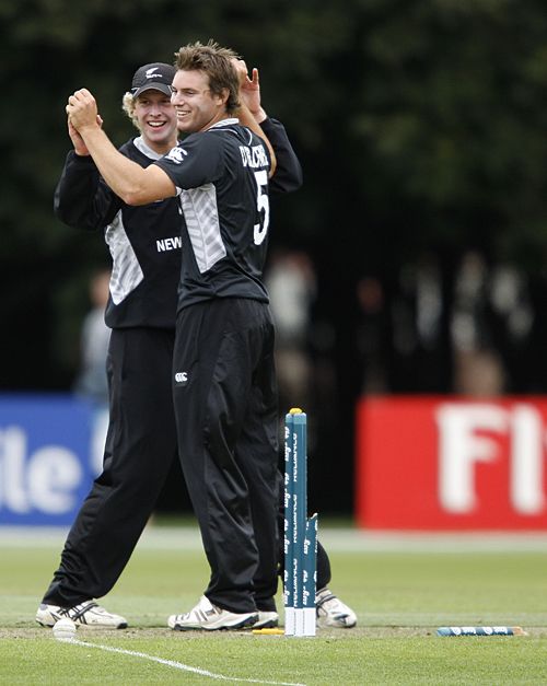 Harry Boam and Doug Bracewell celebrate a wicket