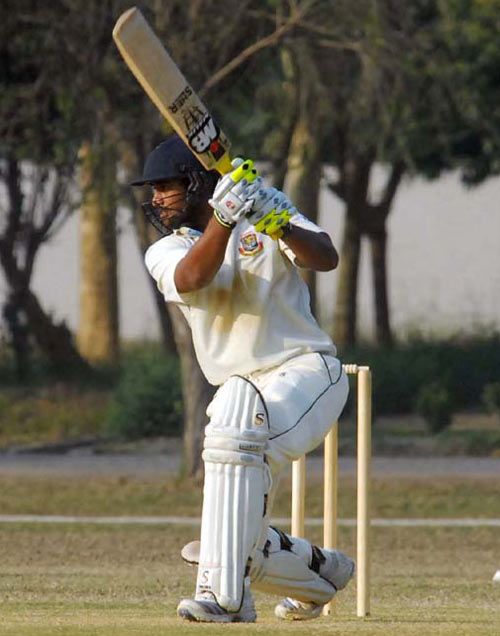 Rajshahi's Farhad Hossain drives during his century against Chittagong