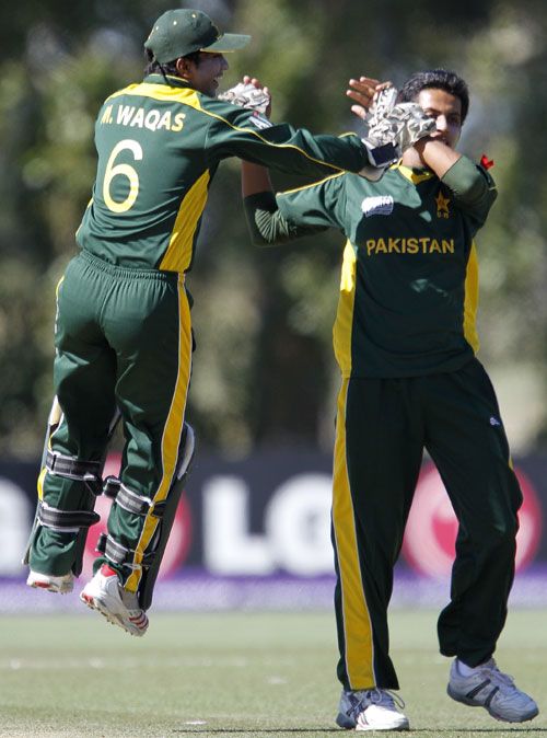 Mohammad Waqas celebrates with Sarmad Bhatti after he dismissed Tom Beaton