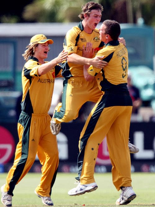 Mitchell Marsh, Josh Hazlewood and Tom Beaton celebrate the fall of Hammad Azam