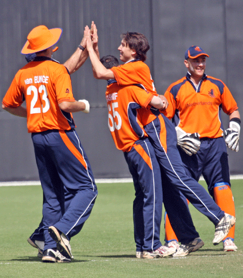 Mark Jonkman is congratulated after taking a wicket
