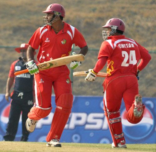 Singapore openers Buddika Mendis and Chetan Suryawanshi take a run