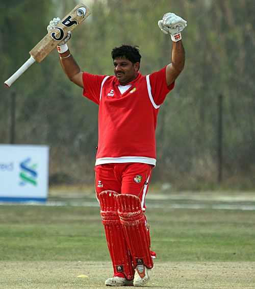 Monish Arora punches the air after guiding Singapore to victory