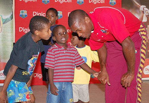 David Bernard listens patiently to his young admirers