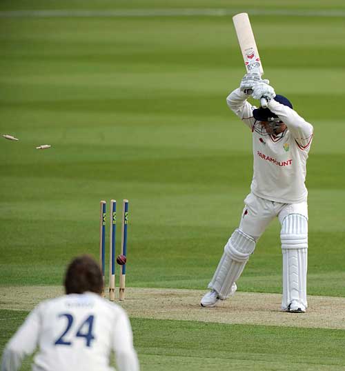 Ben Wright drags into his stumps as he tries to leave
