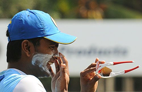 Chinthaka Jayasinghe takes a break during training