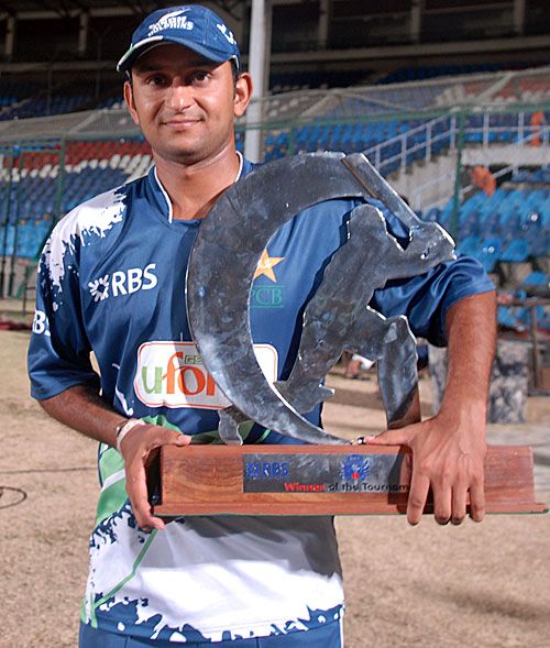 Sind Dolphins captain Faisal Iqbal poses with the winners' trophy