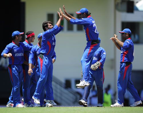 Dawlat Ahmadzai celebrates the dismissal of Gautam Gambhir with his team-mates