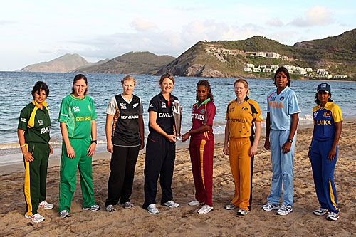 The eight women captains pose with the World Twenty20 trophy