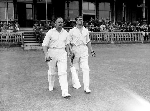 Cec Pepper and Keith Miller walk out to bat