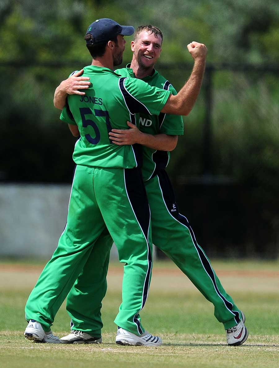 Nigel Jones and John Mooney celebrate another wicket