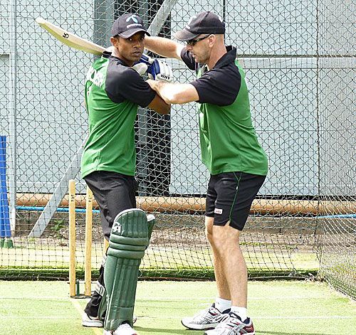 Jamie Siddons works on Faisal Hossain's technique