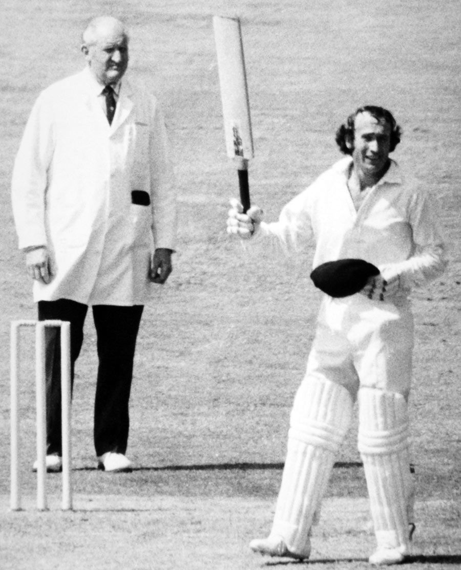 Keith Fletcher salutes the crowd on reaching his century