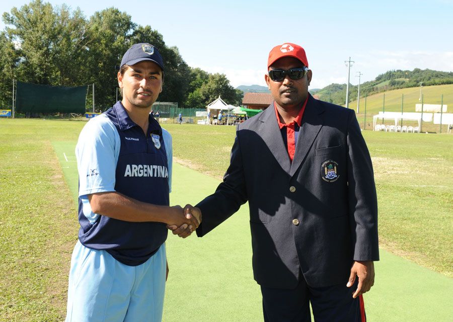 Argentina captain Esteban MacDermott and Cayman Islands captain Saheed Mohamed shake hands ahead of the toss