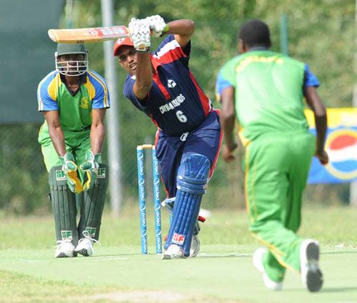 Saheed Mohamed drives during his innings of 37