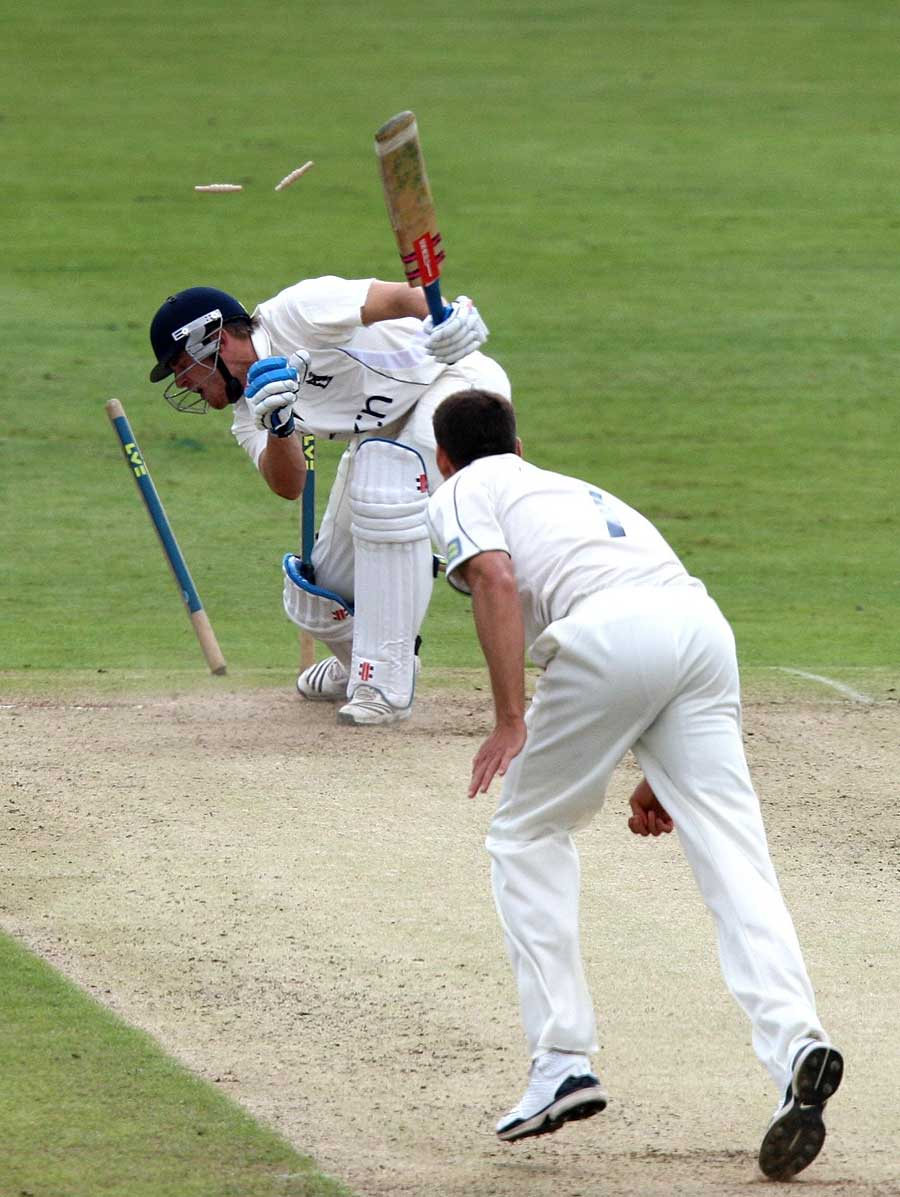 Laurie Evans gets into a tangle as he is bowled by Simon Cook