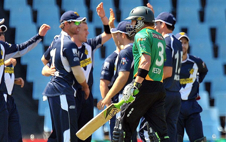 The Victoria fielders celebrate the fall of Tim Weston