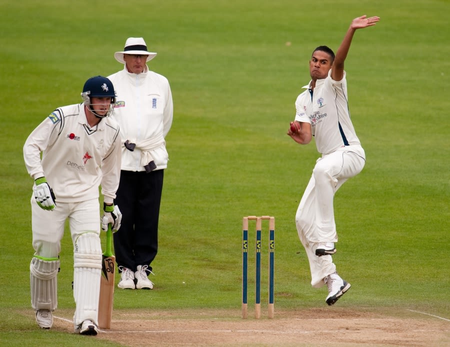 Moin Ashraf bowls before rain forced the players from the field