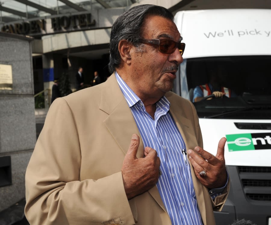 Pakistan team manager Yawar Saeed speaks to the media outside the team hotel in London